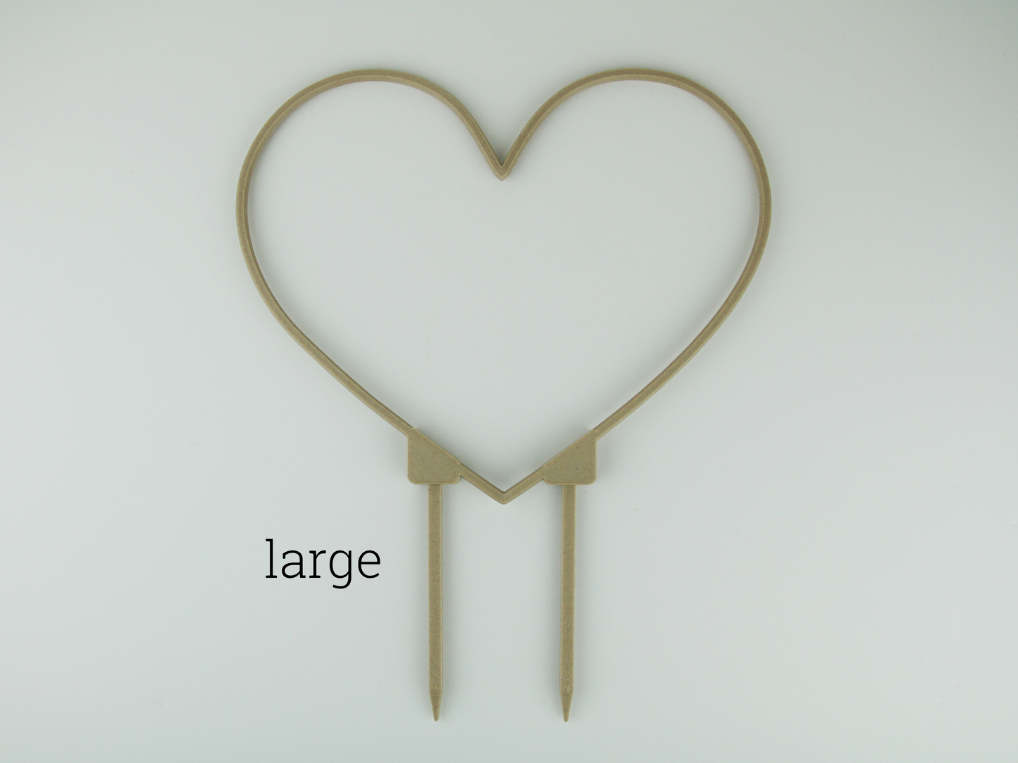 Large heart shaped trellis in wood color