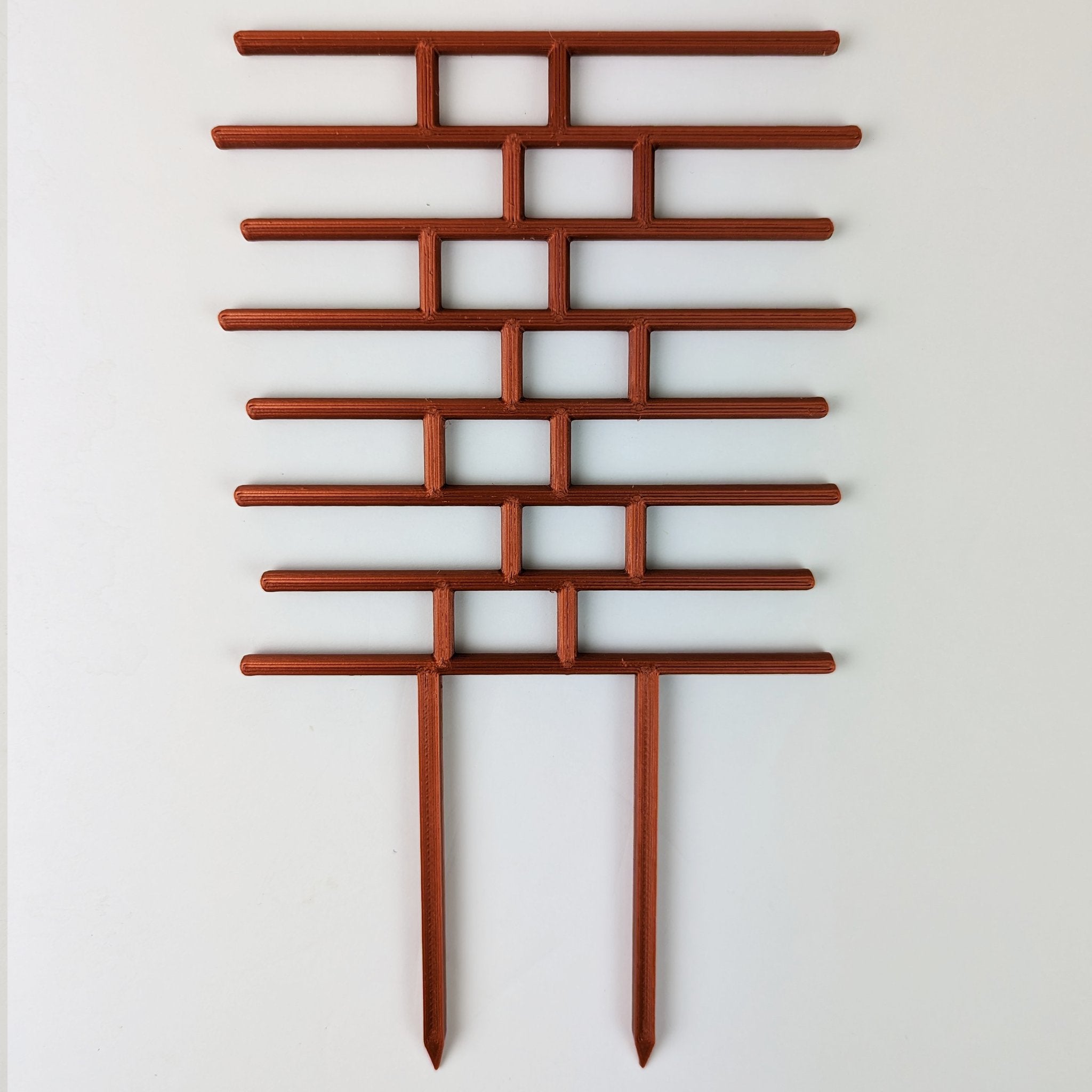 Bricks trellis in copper on a white background