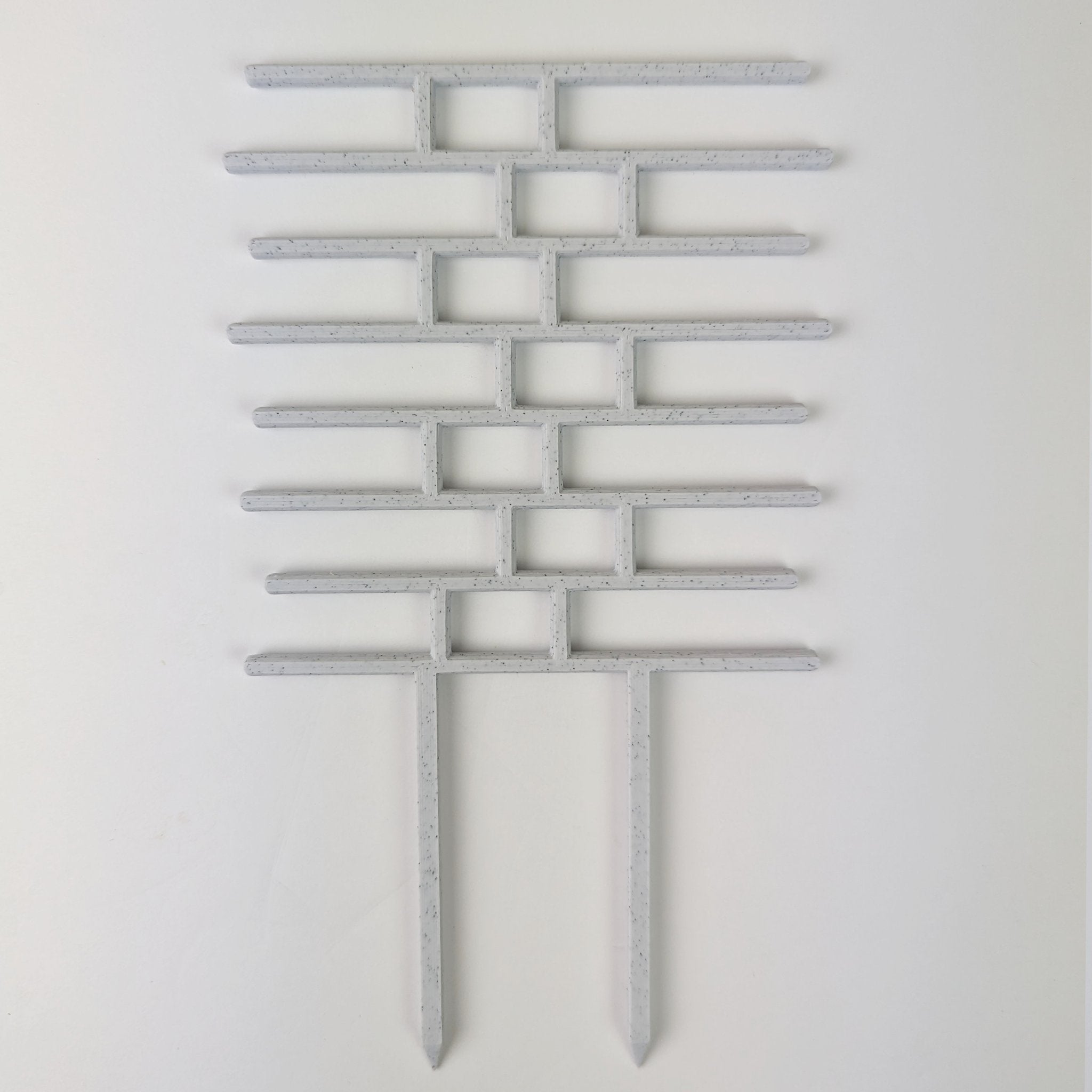Bricks trellis in marble on a white background