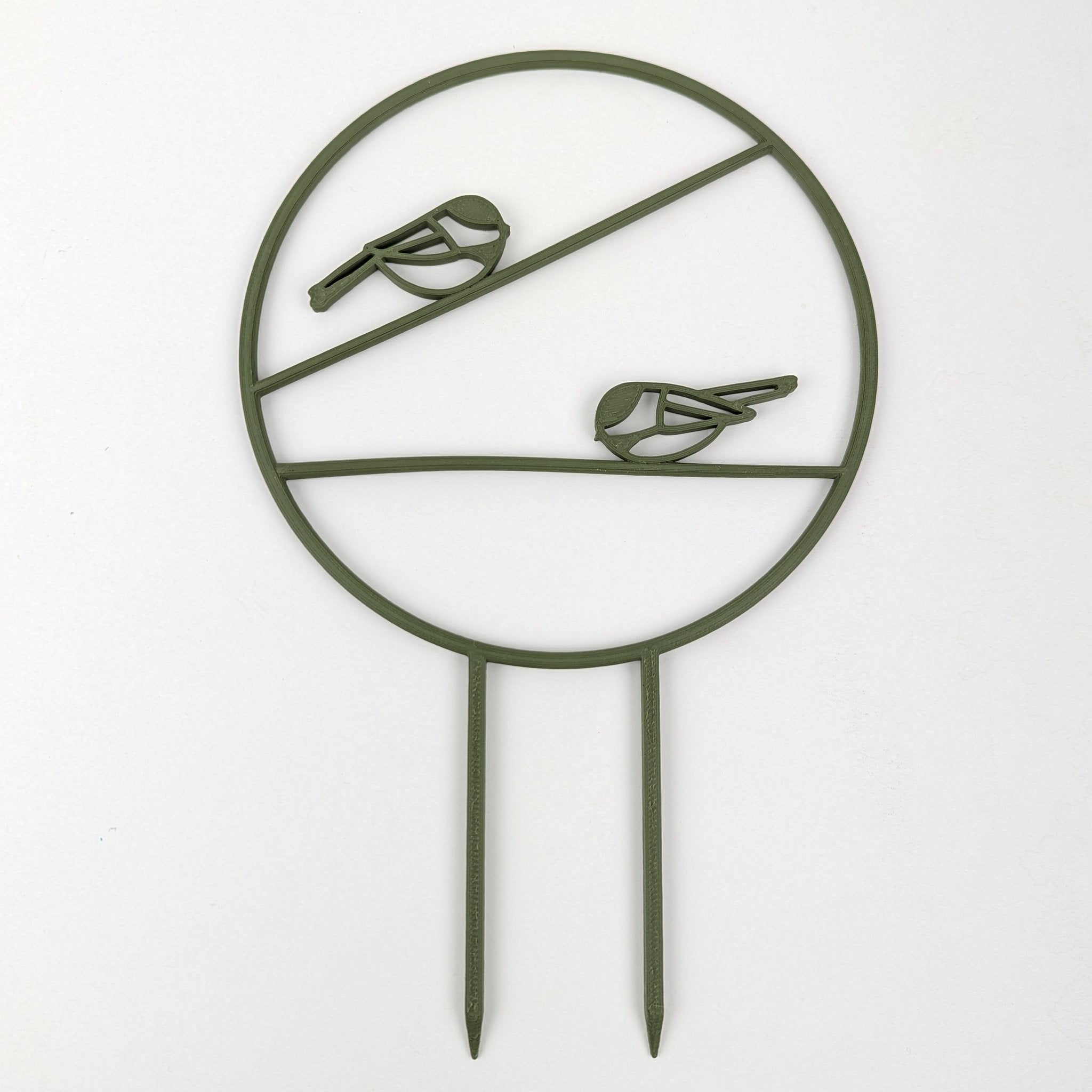 Chickadee trellis in army green, a circle with two chickadees on horizontal branches