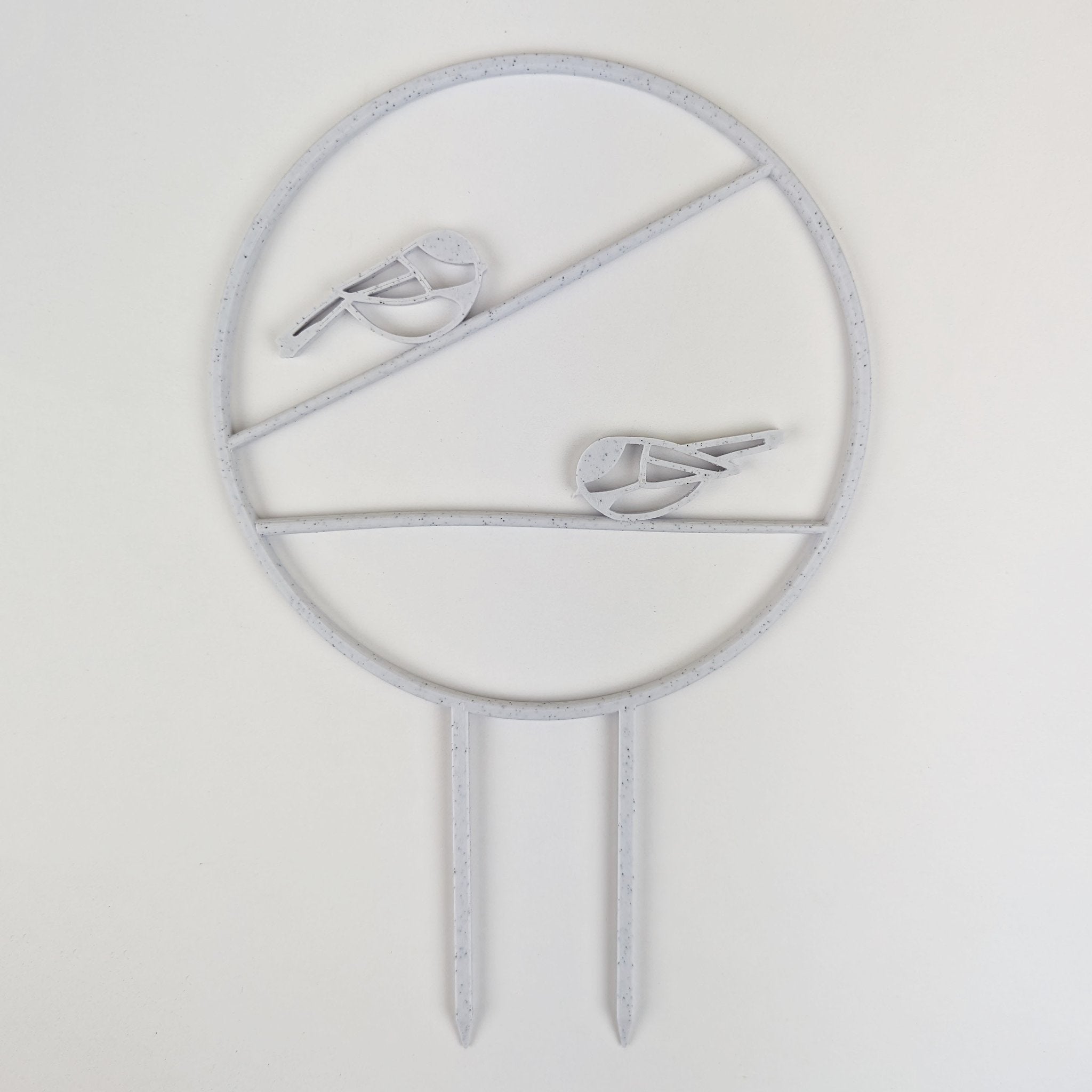 Chickadee trellis in marble, a circle with two chickadees on horizontal branches