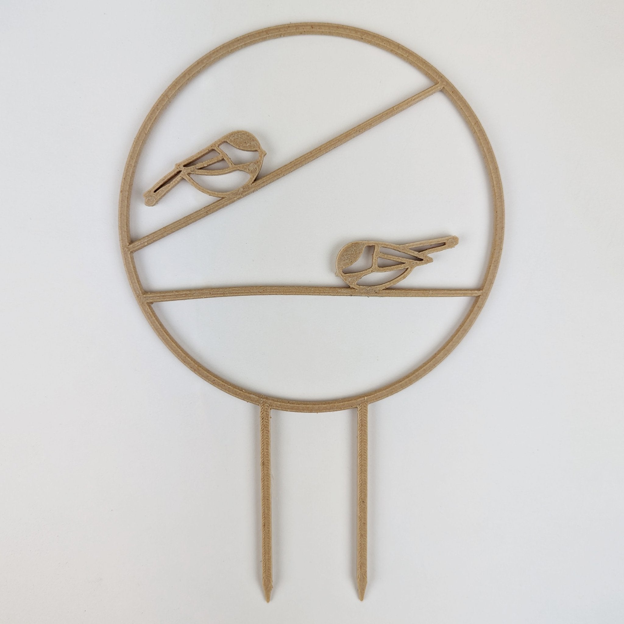 Chickadee trellis in wood, a circle with two chickadees on horizontal branches and two stake legs