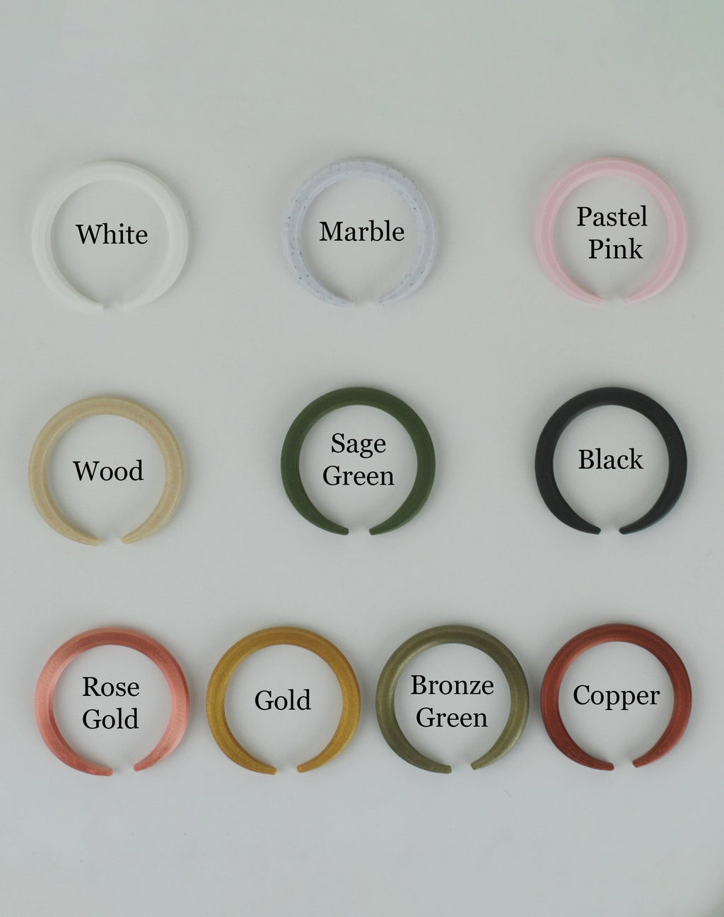 Collection of 3d printed circles in various colors on a white background