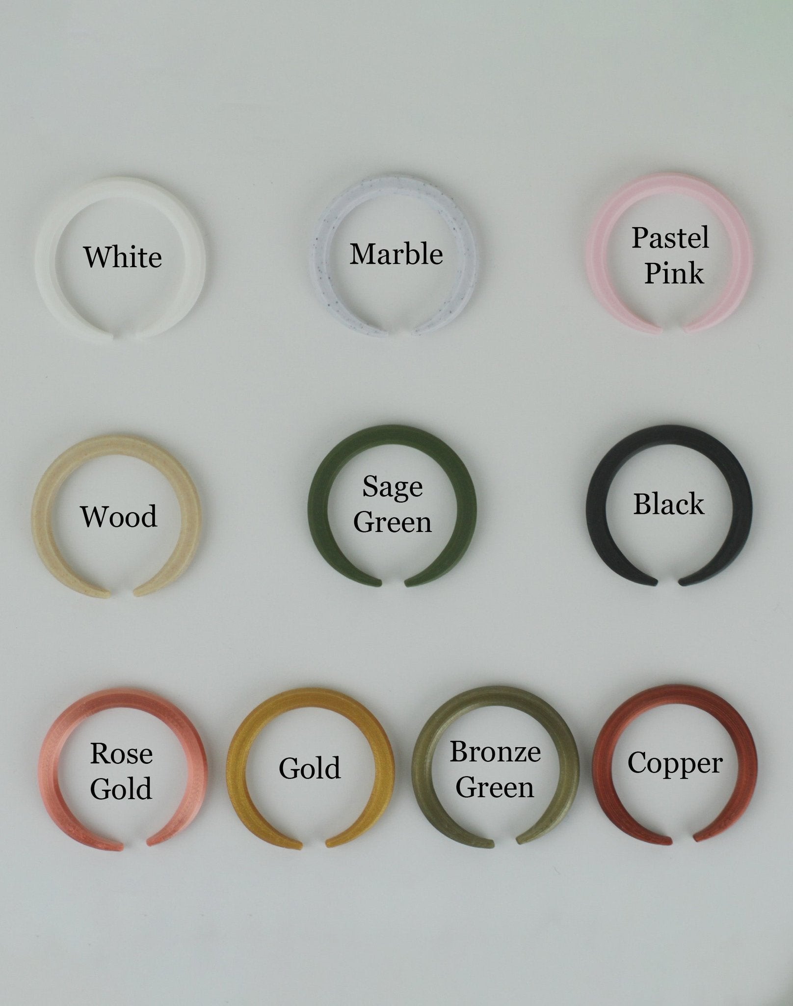 Collection of 3d printed circles in various colors on a white background