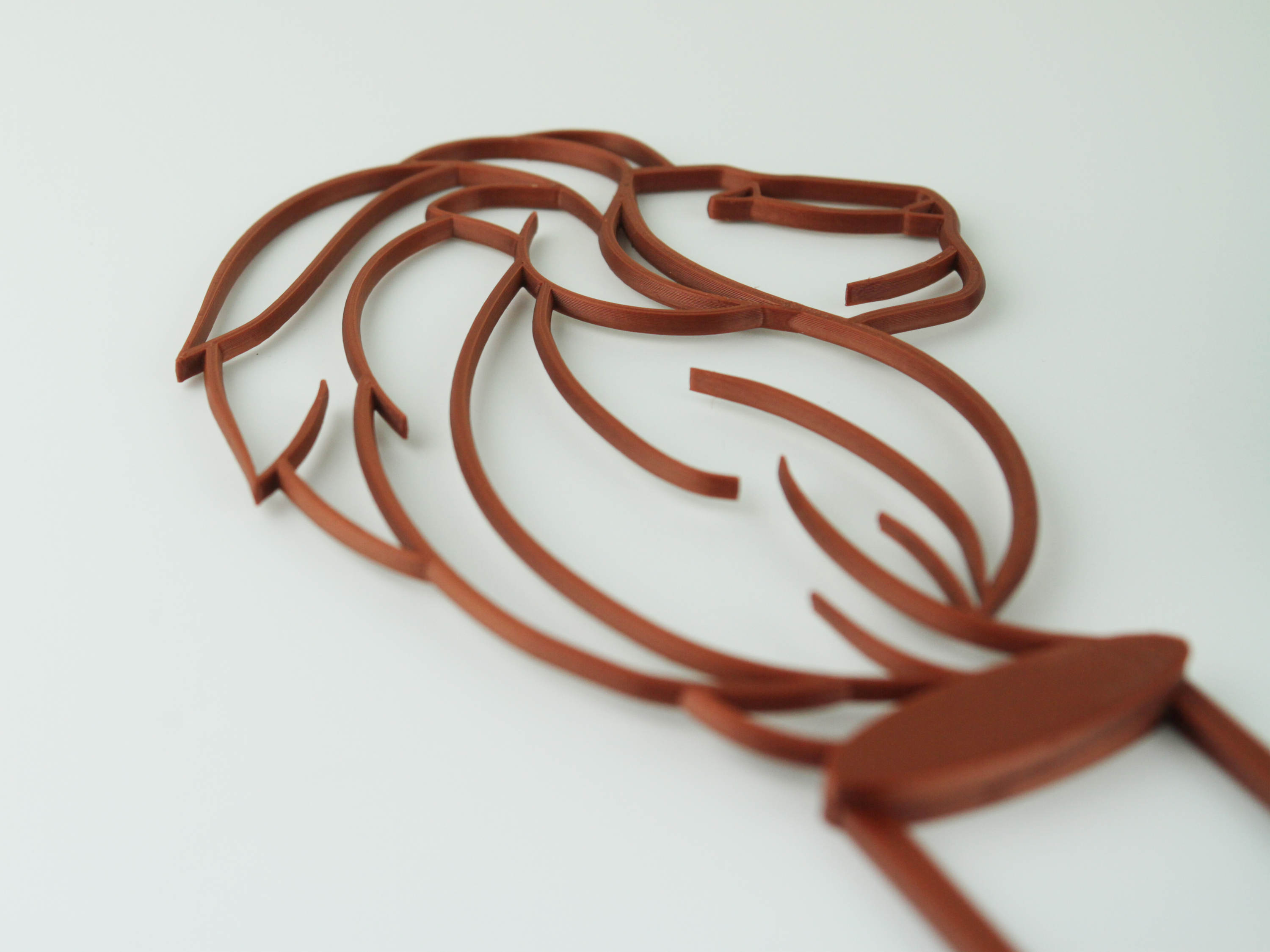 Angled view of lion trellis in copper