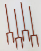 Set of four copper double legged plant stakes for indoor plants