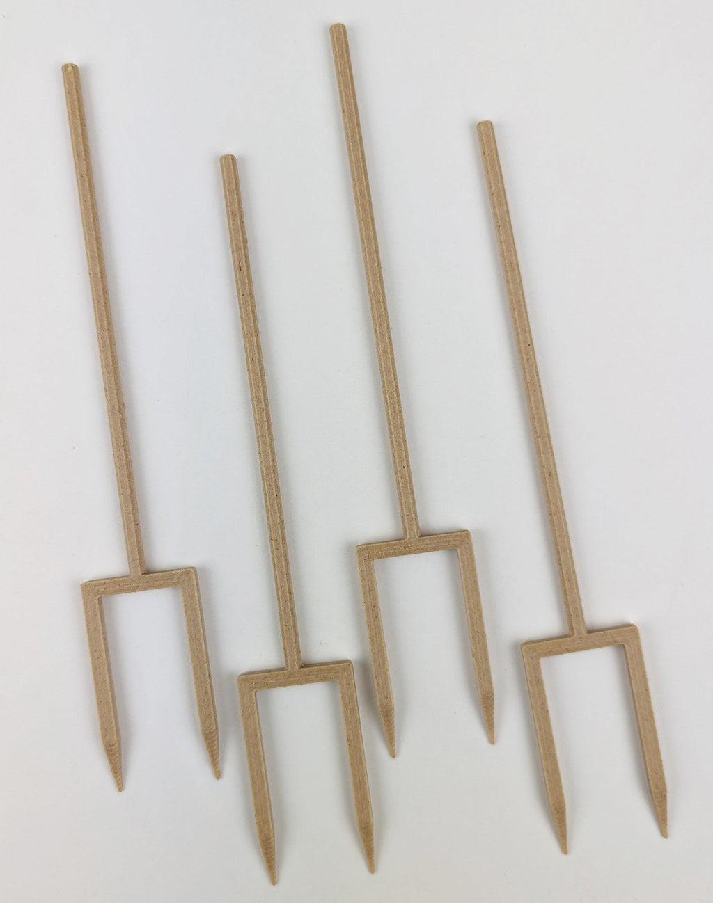 Set of four wood double legged plant stakes on a white background