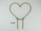 Large heart shaped trellis in a wood finish