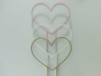 Heart shaped trellises in pastel pink, marble, white and wood