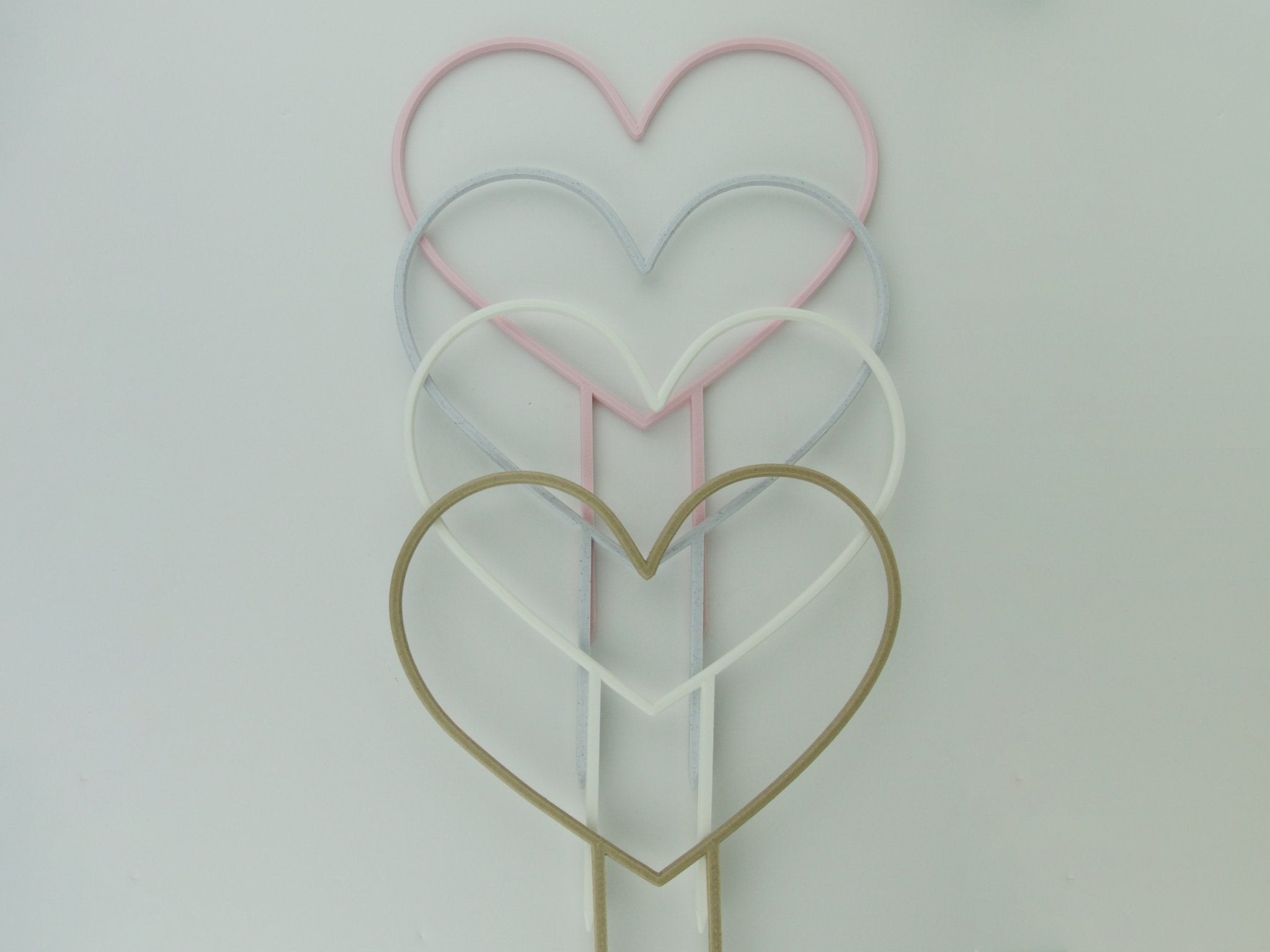 Heart shaped trellises in pastel pink, marble, white and wood