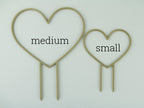 Medium and small heart shaped trellises side by side