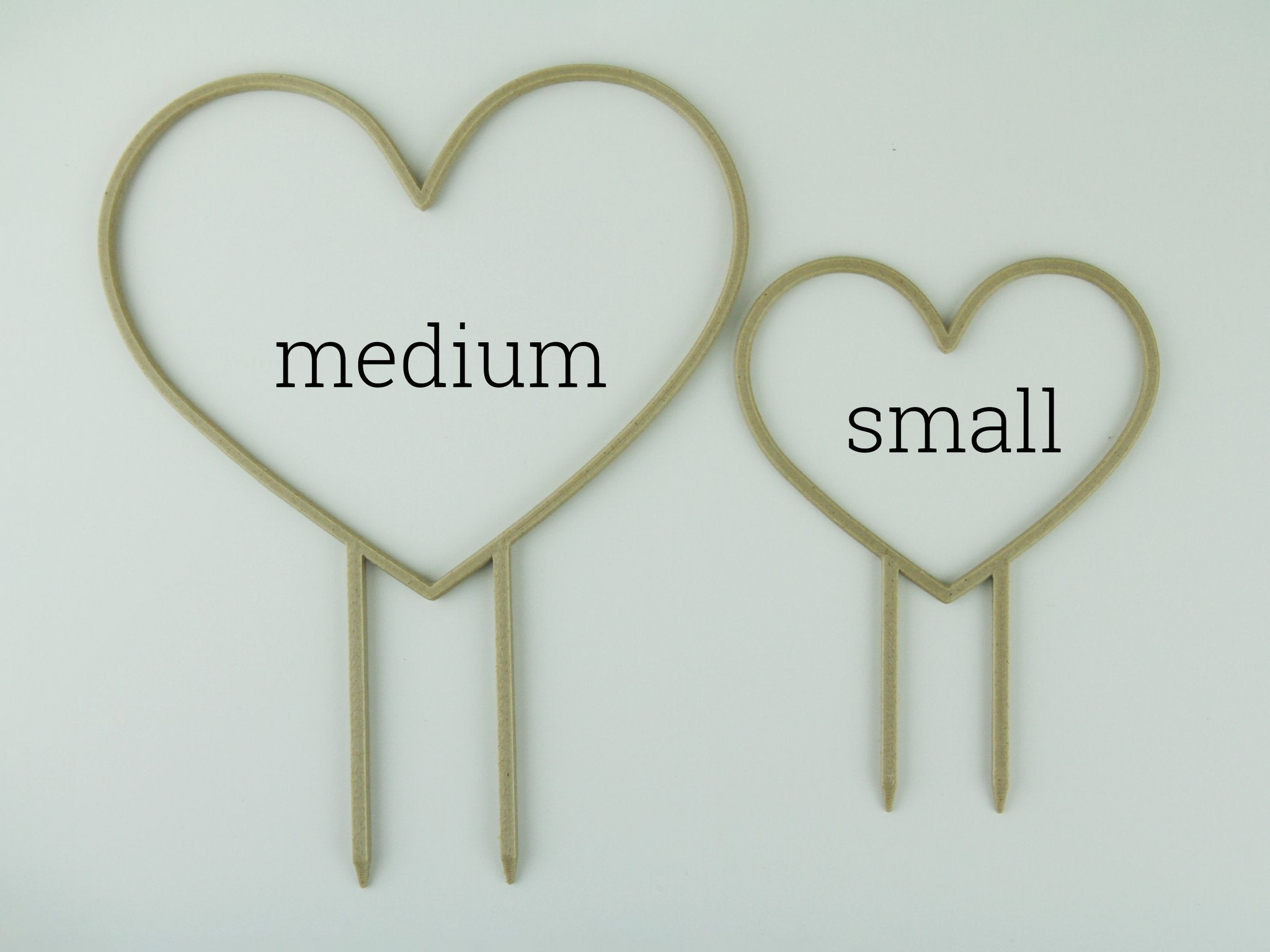 Medium and small heart shaped trellises side by side