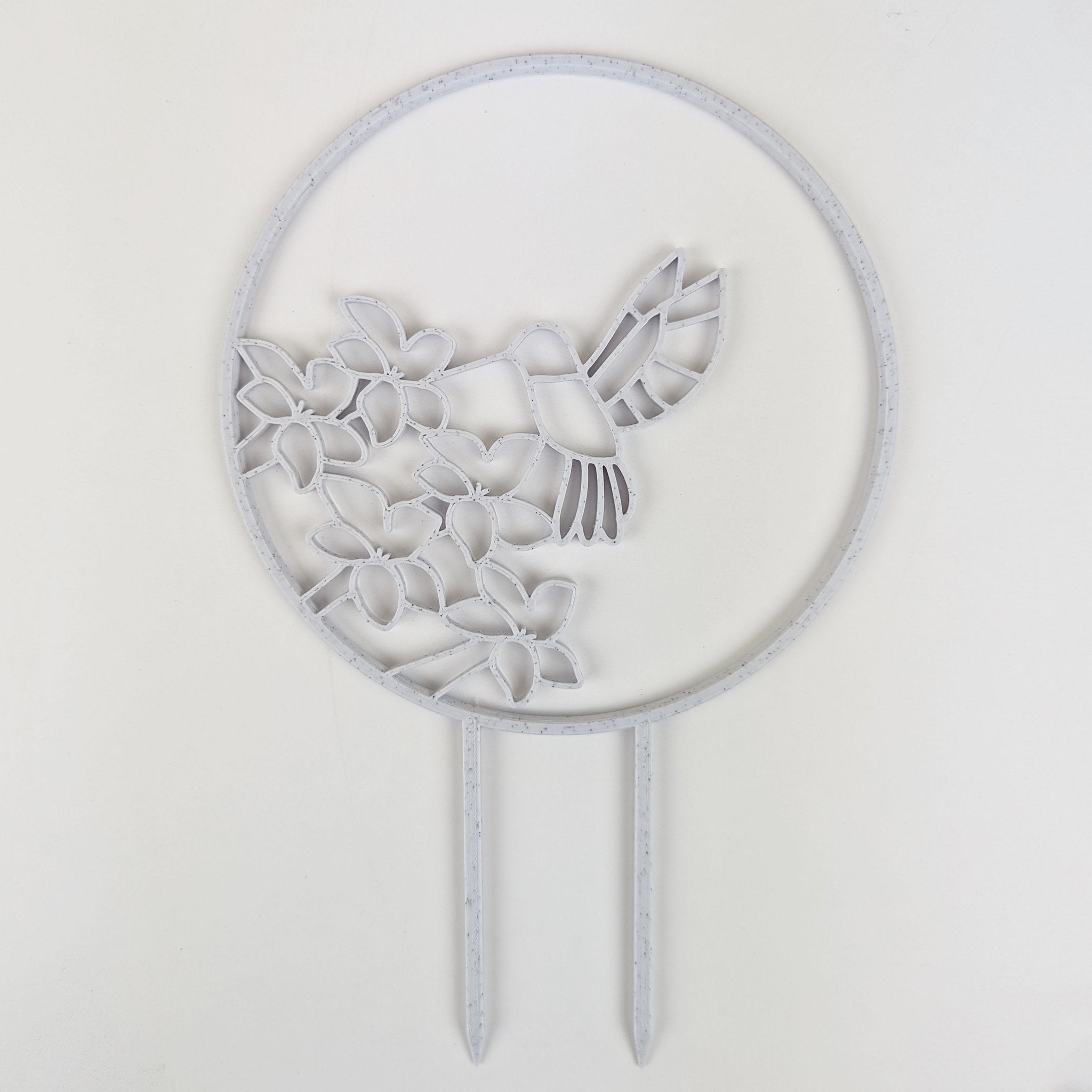 Hummingbird trellis in marble on a white background