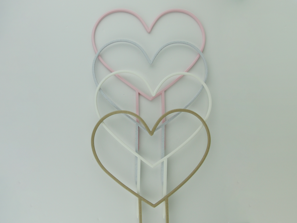 Pastel pink, Marble, White and Wood color heart shaped trellises.