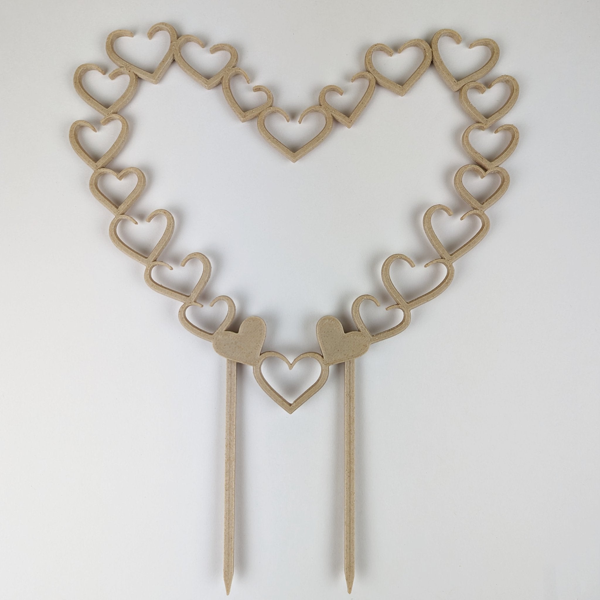 Open hearts trellis in wood on a white background