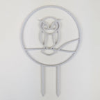 Owl trellis, a circle with an owl silhouette inside, in marble