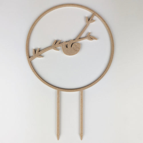 Sloth circle trellis in a wood finish, a sloth hanging from a branch inside the circle