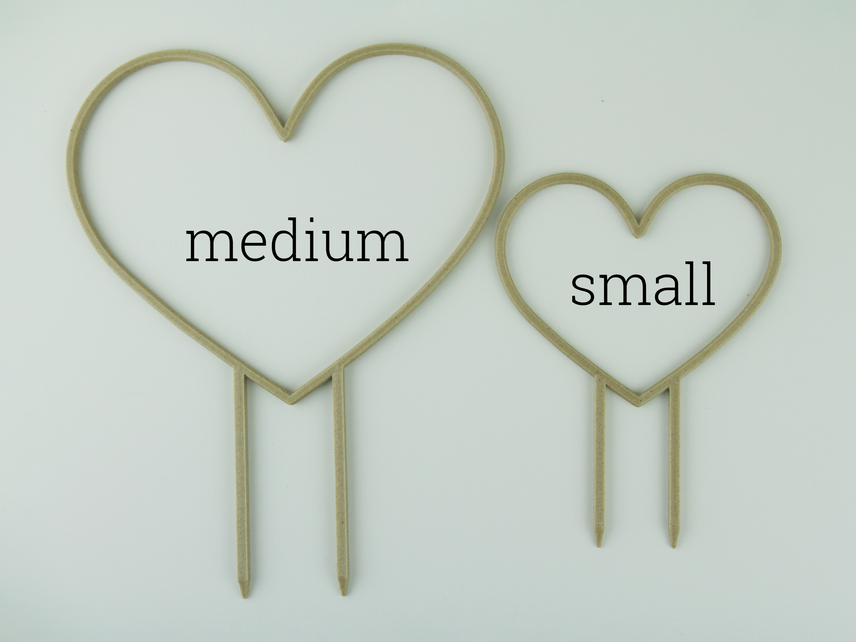 Medium and small size heart shaped trellises side by side