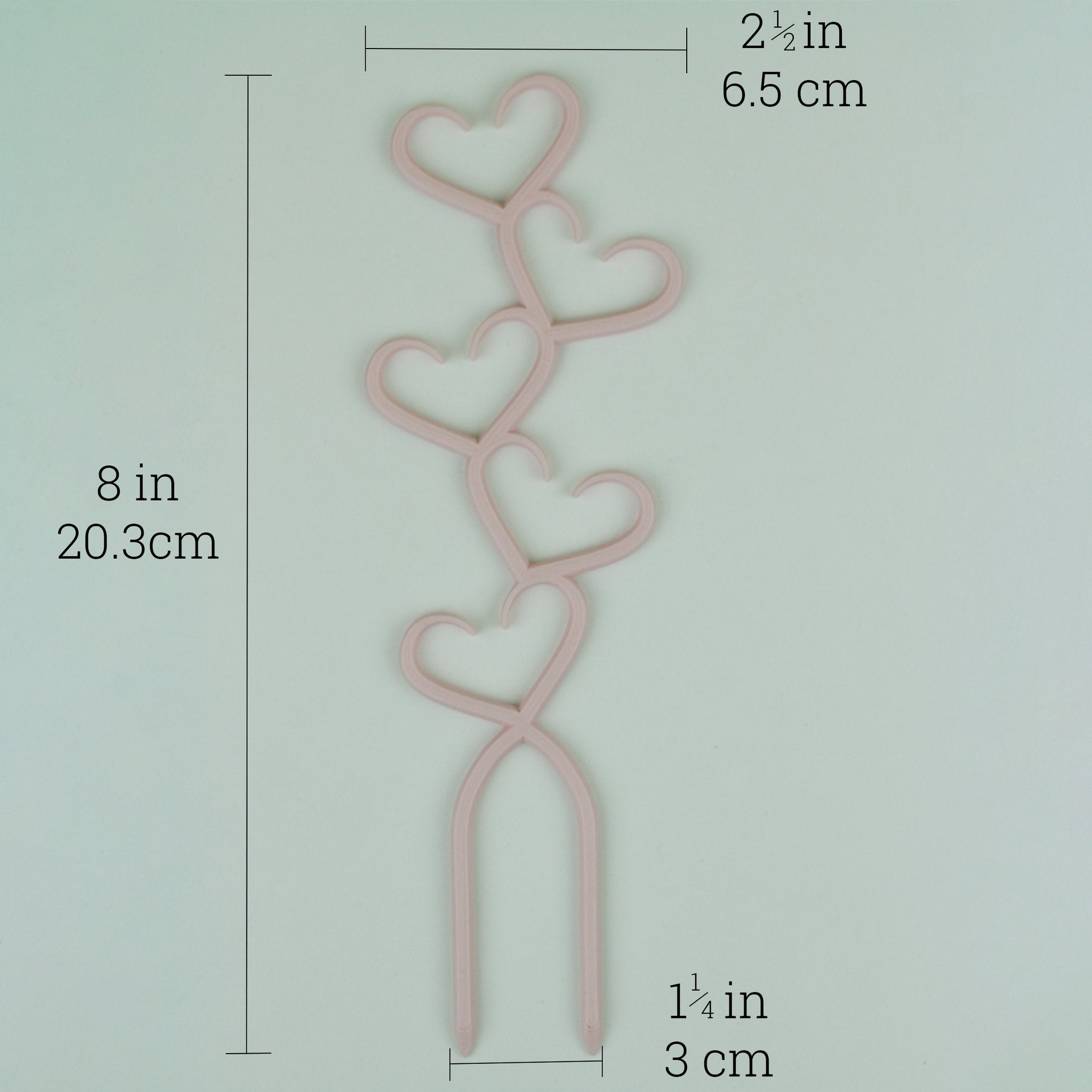 Pastel pink stacked hearts trellis with dimensions, 8 by 2.5 inches