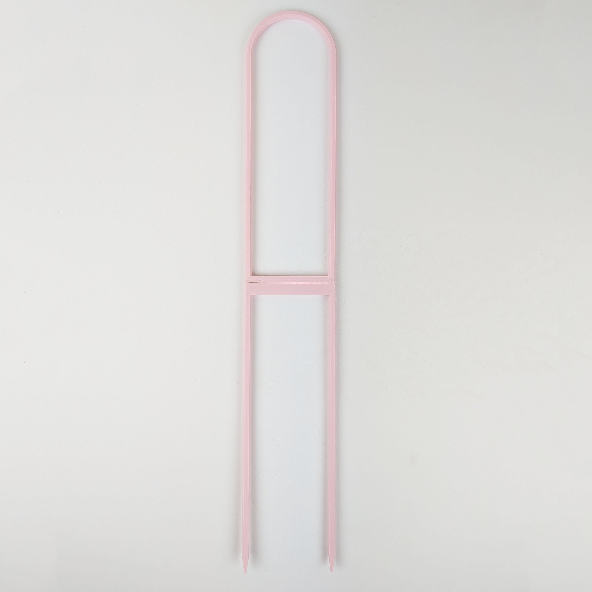 Extra large U trellis in pastel pink on a white background
