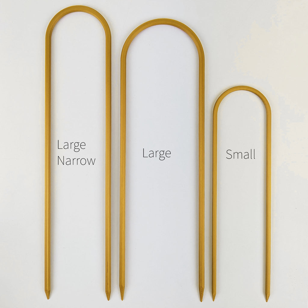 All three sizes of U trellises in gold, side by side