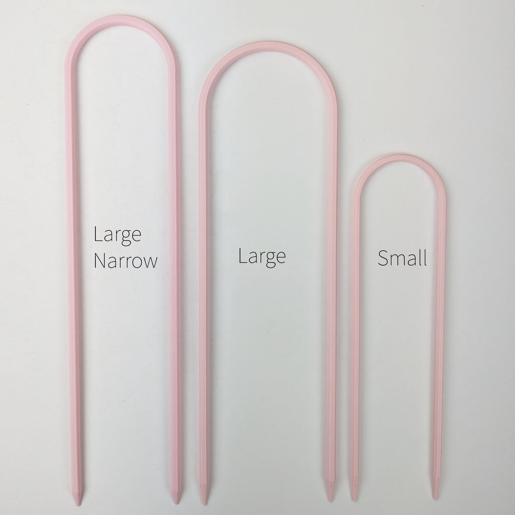 All three sizes of U trellises in pastel pink, side by side