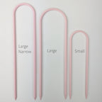All three sizes of U trellises in pastel pink, side by side