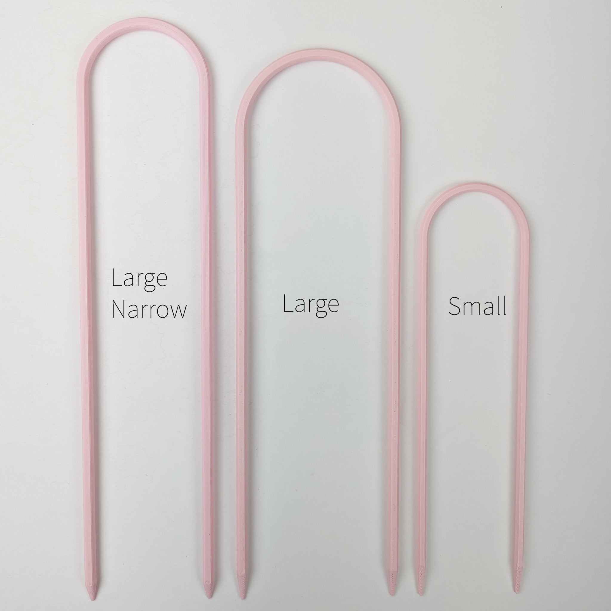 All three sizes of U trellises in pastel pink, side by side