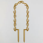 U wreath trellis in gold on a white background