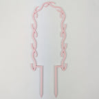 U wreath trellis in pastel pink on a white background