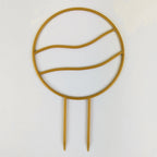 Wavy circle trellis in gold on a white background