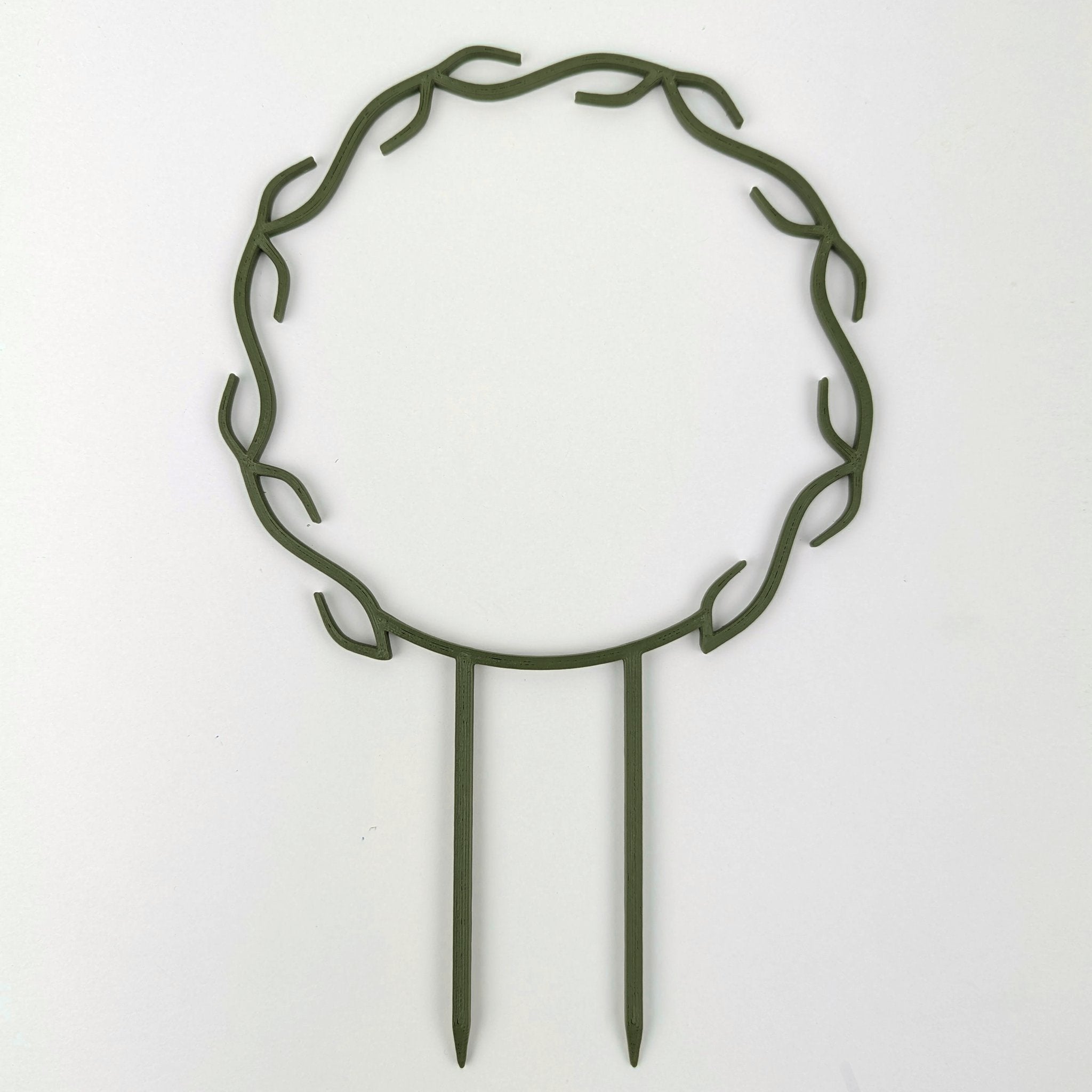 Wreath trellis in dark army green, built-in hooks circling like a wreath