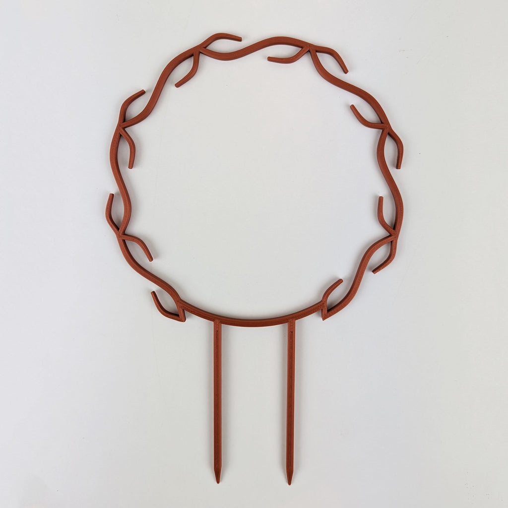 Wreath trellis in copper, built-in hooks circling like a wreath