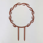 Wreath trellis in copper, built-in hooks circling like a wreath