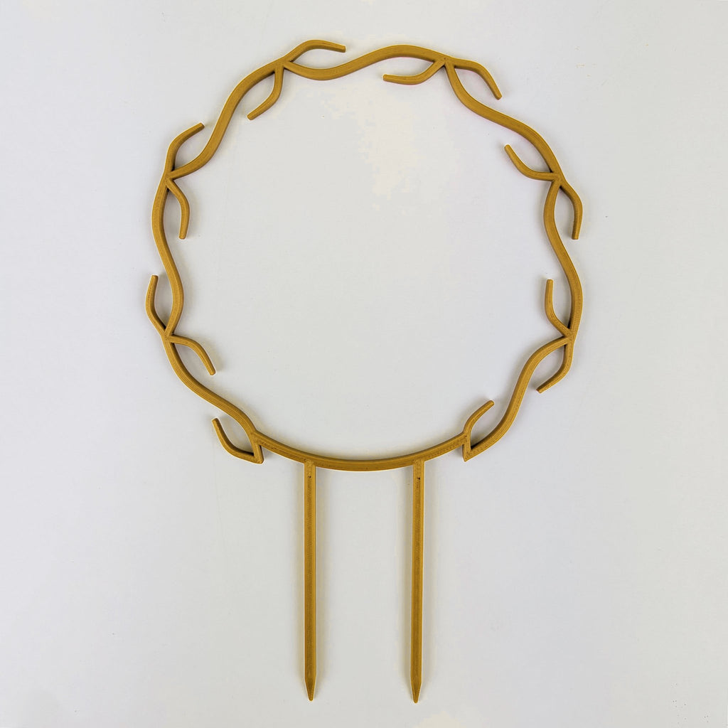 Wreath trellis in gold, built-in hooks circling like a wreath