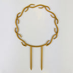 Wreath trellis in gold, built-in hooks circling like a wreath