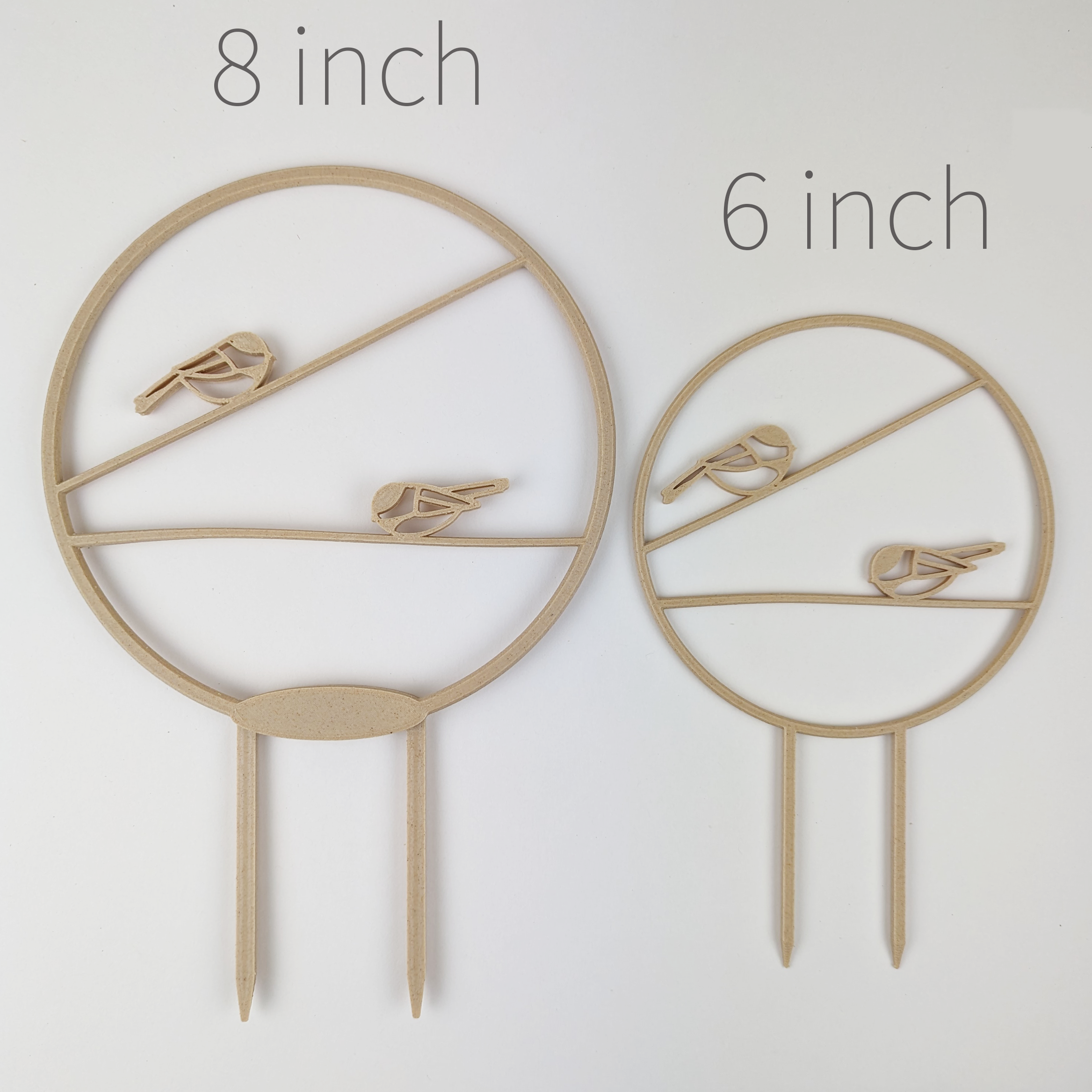 Two Chickadee Trellises, large and small side by side for size comparison
