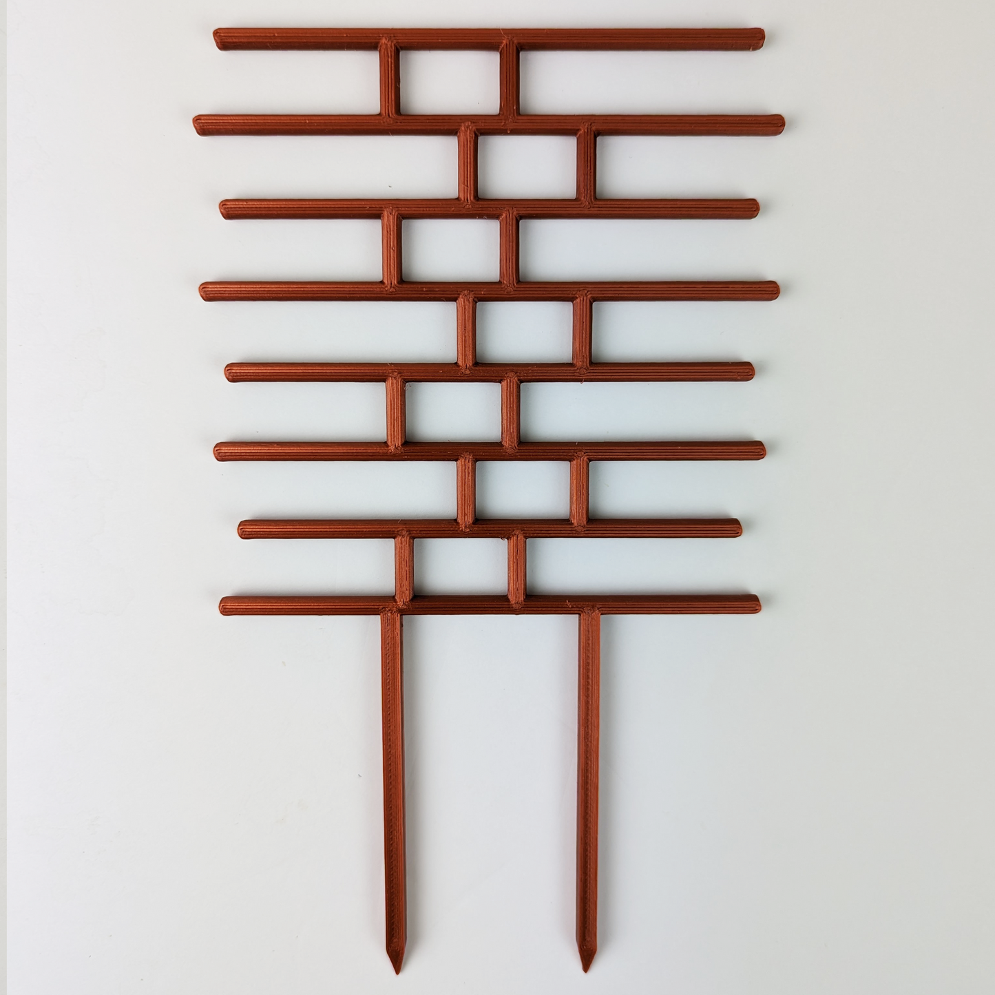 Brick pattern inspired trellis in copper