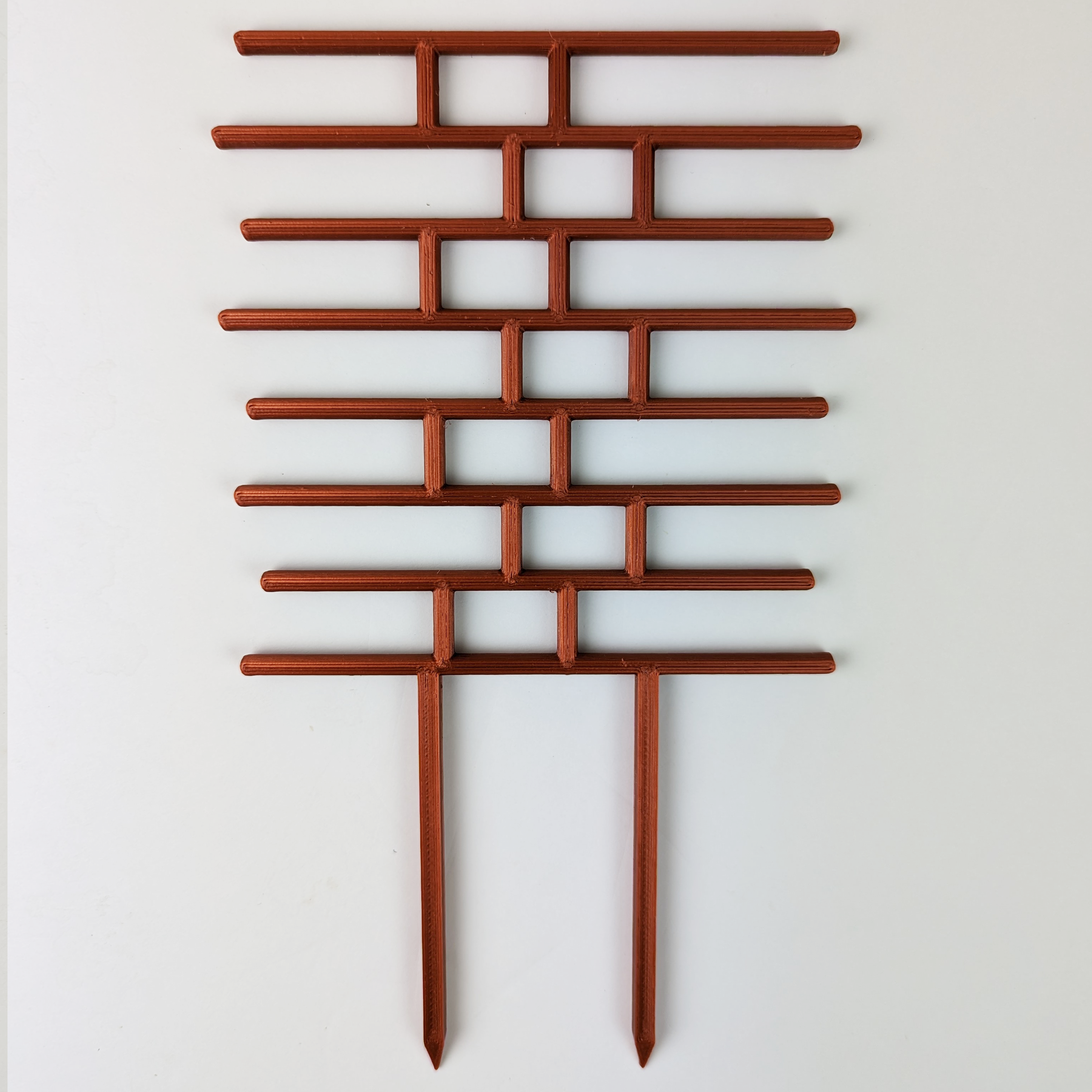 Brick pattern inspired trellis in copper