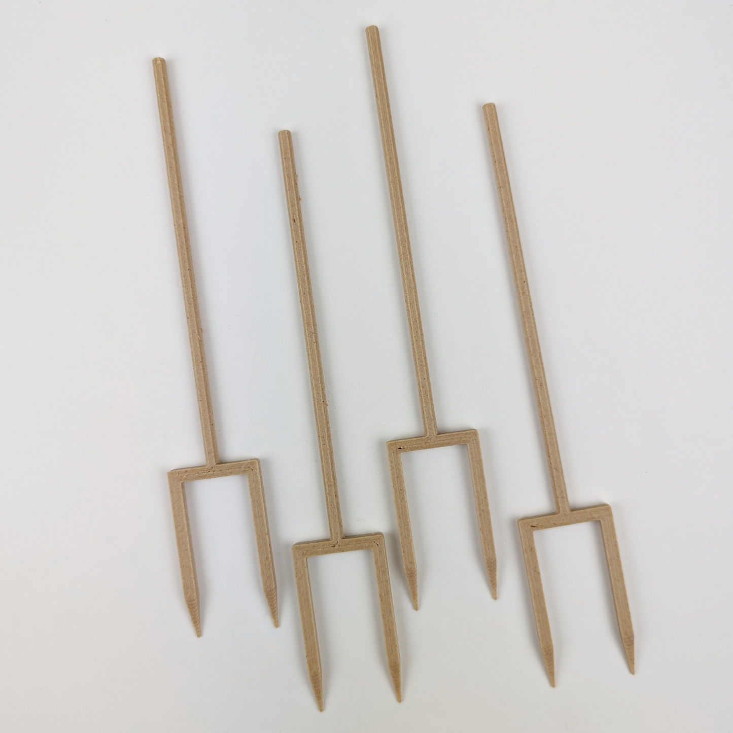 4 double legged stakes in the color wood