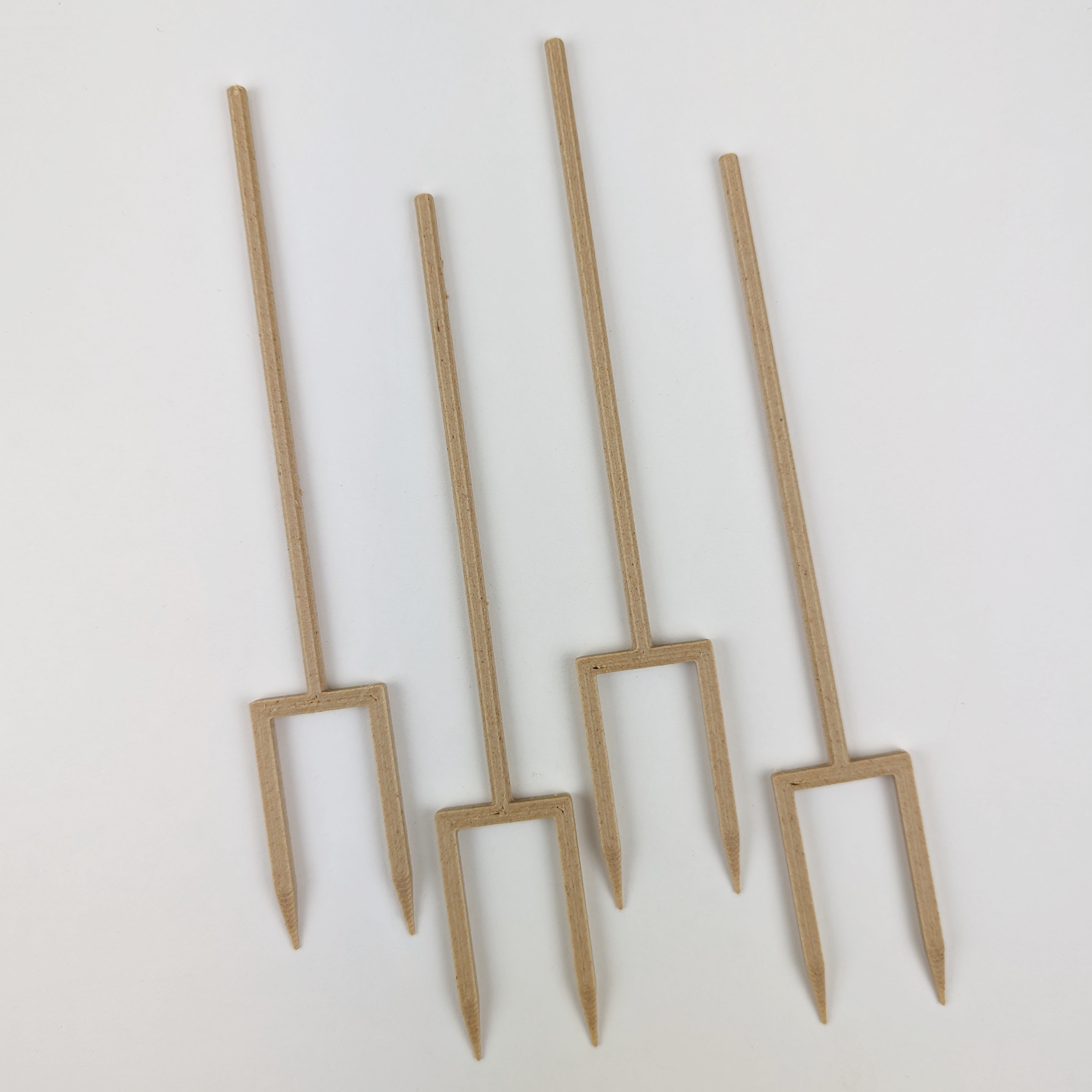 4 double legged stakes in the color wood