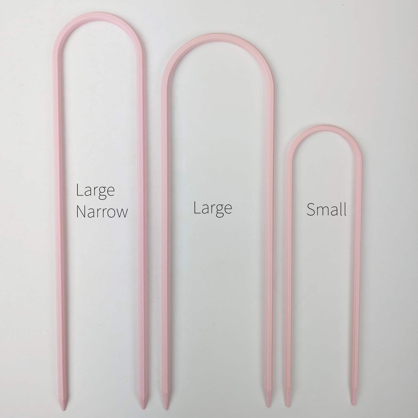 All three sizes of U trellises in pastel pink color, side by side