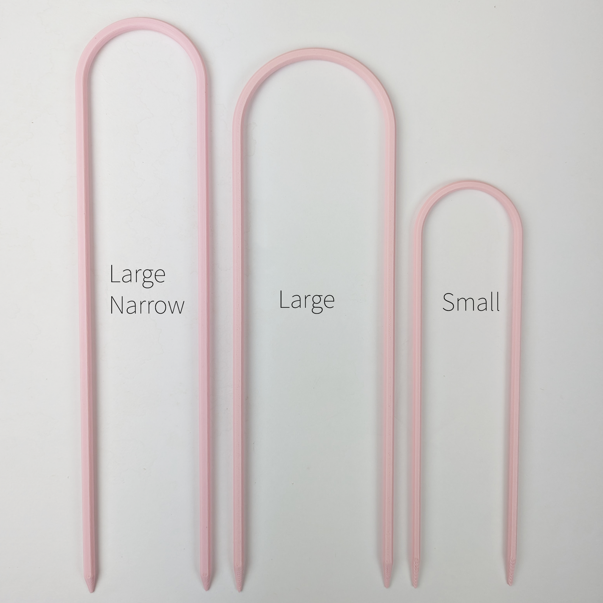 All three sizes of U trellises in pastel pink color, side by side