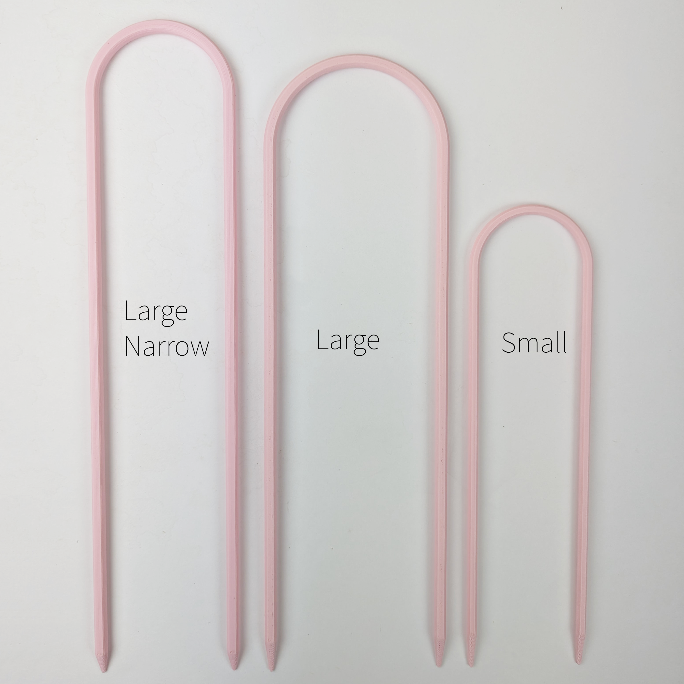 All three sizes of U trellises in pastel pink color, side by side