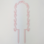 U Wreath Trellis in pastel pink colour against a plain white background