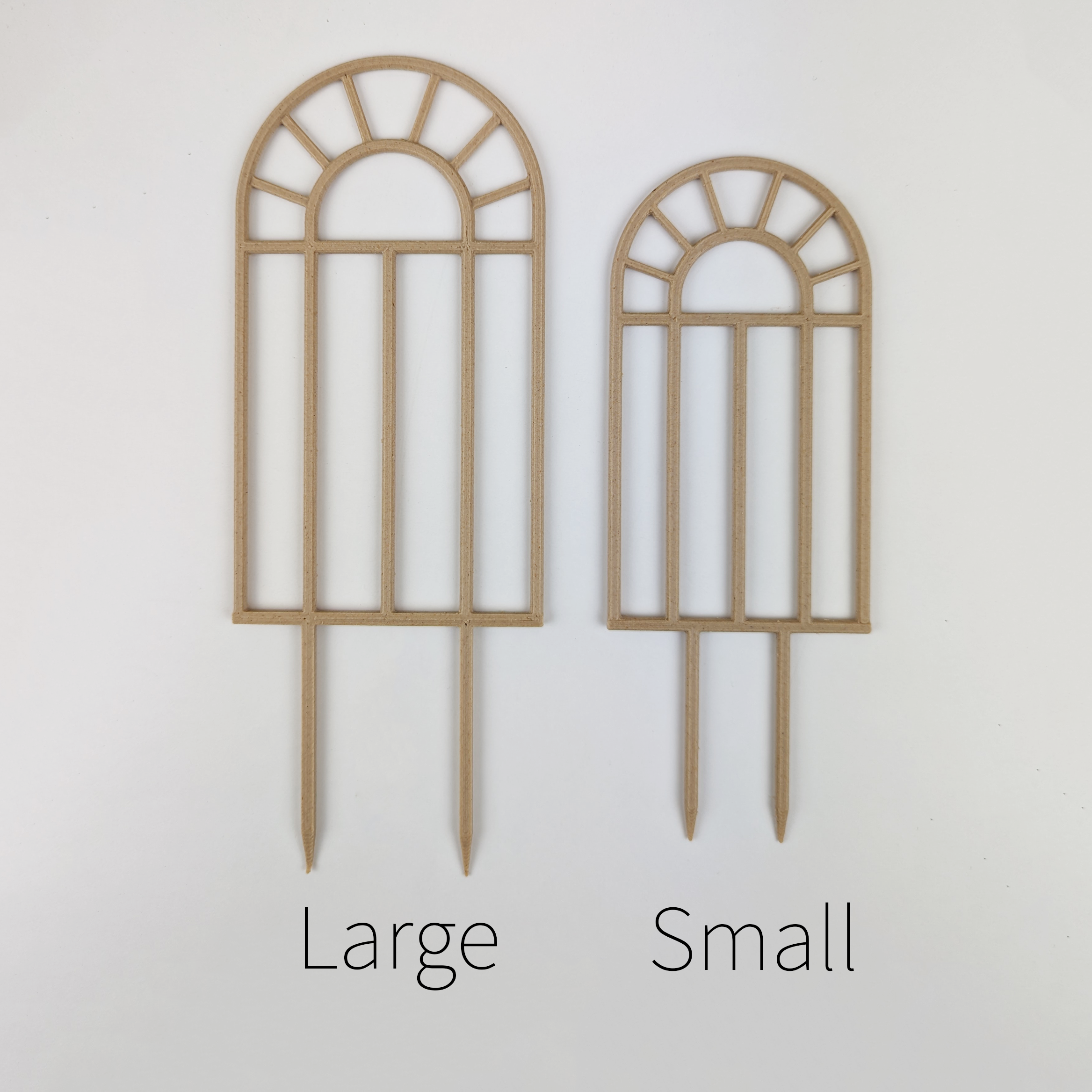 Two arch window trellises, one large and small side by side to show size difference.